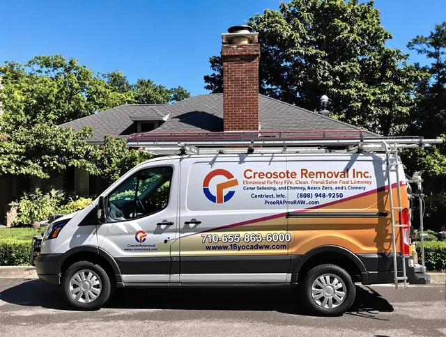 Medfield Chimney Sweep technician removing creosote safely in Medfield, MA