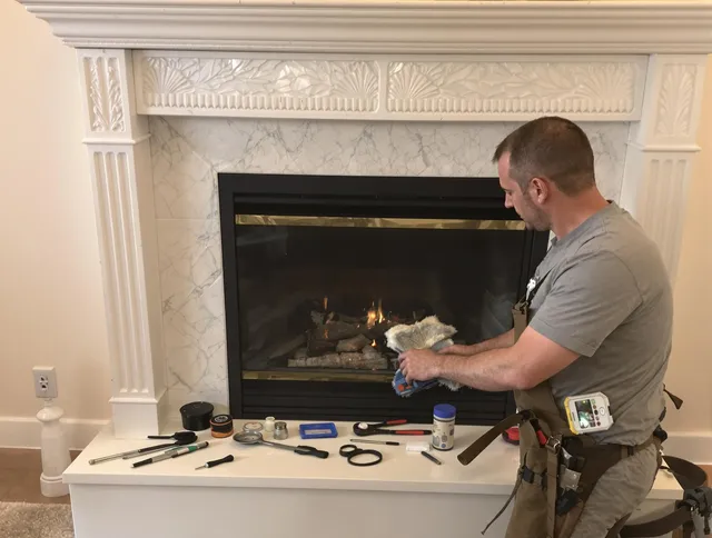 Medfield Chimney Sweep performing fireplace maintenance in Medfield, MA